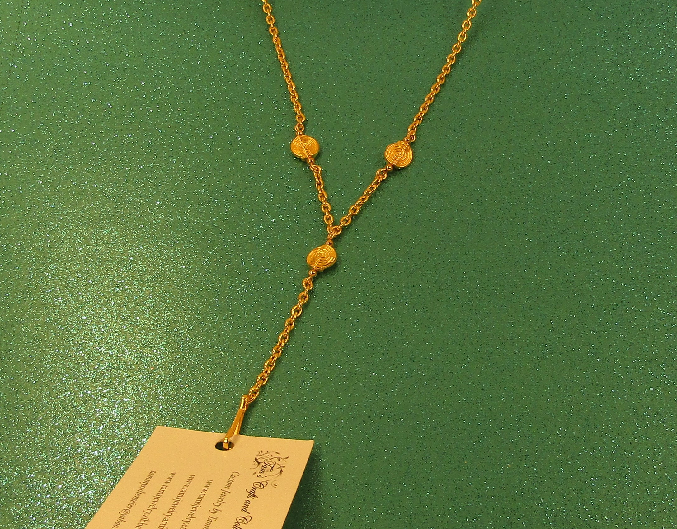 Gold swirling gold chain badge holder necklace